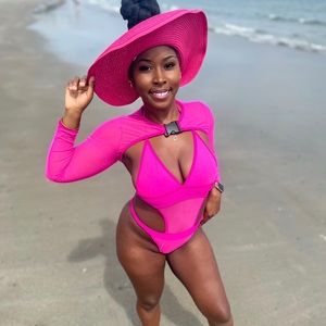 Selling pink one piece bathing suit with sheer buckle cover